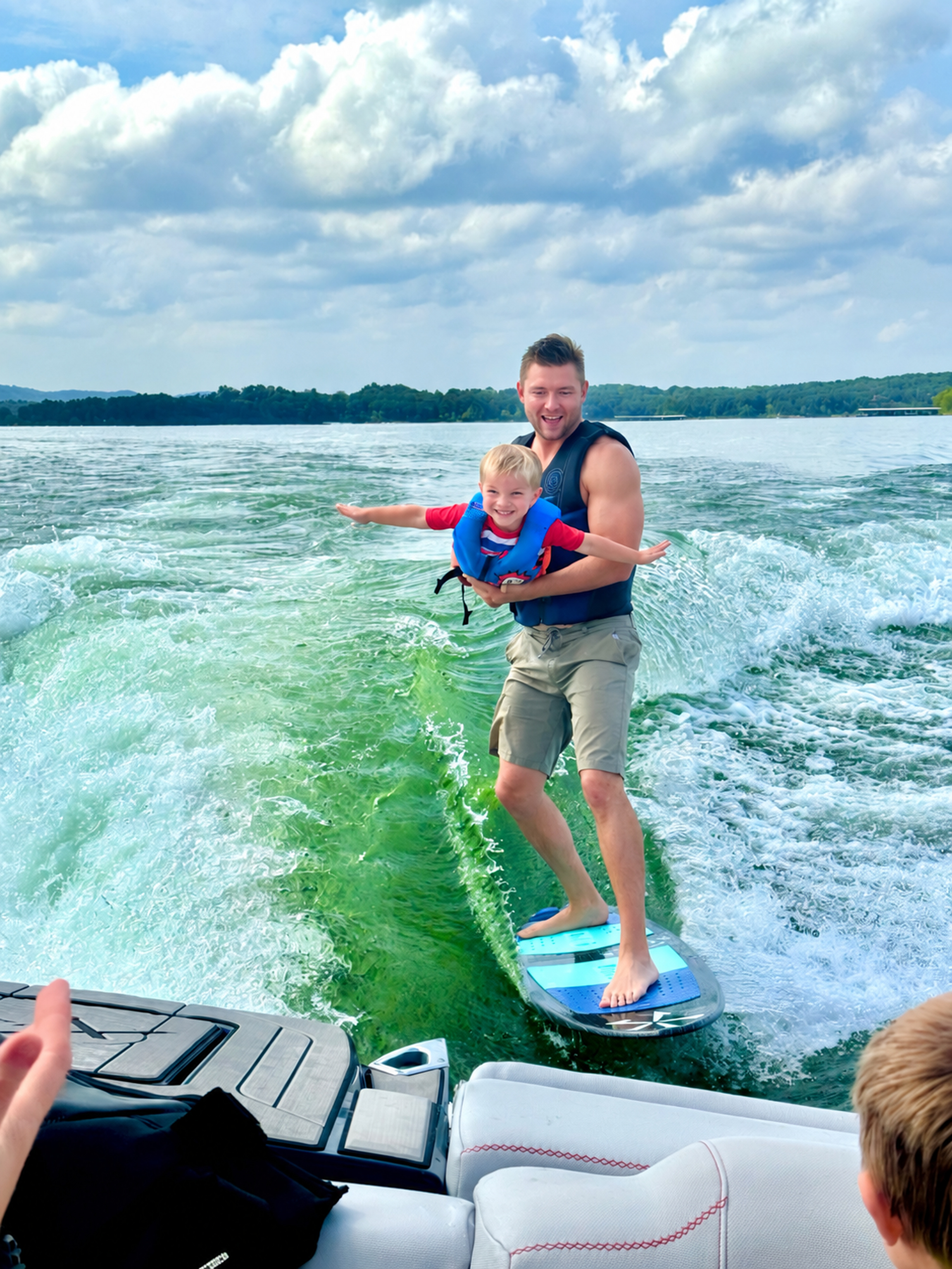 Dane wakesurfing with his son